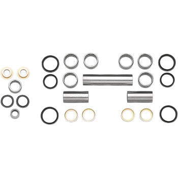 Set of metal and rubber swingarm linkage bearings and spacers in silver and black colors arranged on white background.