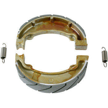 Ebc Brake Shoes are shown as two semi-circular, grooved brake shoes with matching springs, arranged on die-cast aluminum platforms, all set against a white background.