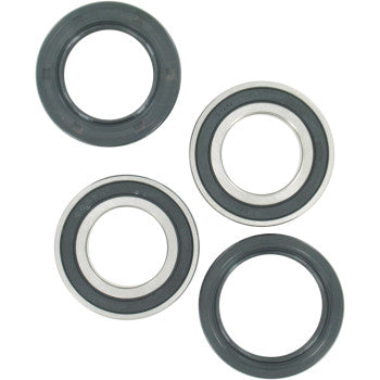 The Can Am Polaris Kayo Wheel Bearing Kit Rear by Pivot Works includes two black rubber seals and two metallic bearings with black inner rings, shown on a white background for enhanced steering control.