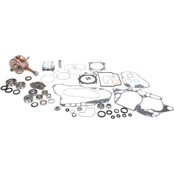 Complete Honda TRX R engine rebuild kit with copper crankshaft, assorted metal gaskets, and rubber seals arranged on white.