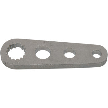 The Shift Lever Bell Crank by Quad Logic is a flat, silver metal lever with one steel spline hole on the left and two smooth circular holes in the center and right. It has rounded ends and a sleek, elongated design.