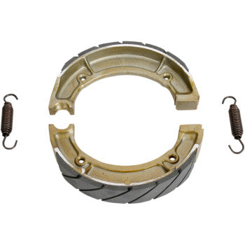 Ebc Brake Shoes are shown, featuring two semi-circular metallic shoes with grooved surfaces and robust brake linings, accompanied by two coiled metal springs positioned on either side.