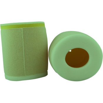 Two green cylindrical Kawasaki - Suzuki - Arctic Cat Pre Oiled Air Filters by No Toil are shown: one upright to display the smooth surface, the other on its side revealing a hollow center—designed for strength and use with biodegradable cleaner.