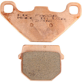 Ebc Sintered "R" Brake Pads are shown: the top copper-toned pad features engraved markings, and the bottom displays a textured friction surface. Both have mounting holes and provide reliable performance for demanding systems.