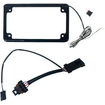 The Lighted License Plate Frame Gloss Black by Custom Dynamics, shown with a plug and play harness and a black wiring harness with connectors and colored wires for easy installation, is displayed on a white background.