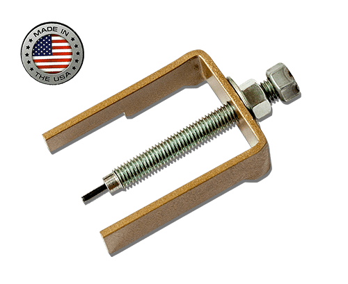 The X3 Driven Roller Pin Extractor by Trinity Racing features a U-shaped brass frame, threaded bolt and nut, and a black tip—perfect for Can-Am X3 or Maverick Sport 1000R roller secondary clutches. Proudly made in the USA with an American flag badge.