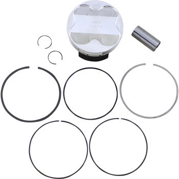 Silver metallic piston with flat top and five black piston rings arranged below, plus small metal pin and two circular.