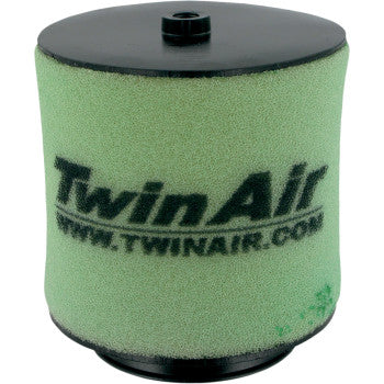 Cylindrical green foam air filter with black plastic top and bottom, Twin Air logo printed in black on side.