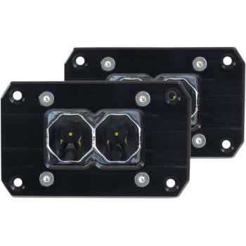 The Flood Light 2" Clear Lens Flush Mount by Heretic includes two rectangular black LED modules, each with CREE LEDs delivering 1452 lumens, featuring dual round lenses, stainless steel mounts, and corner mounting holes, shown on a white background.