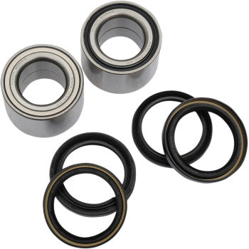 Two silver metal wheel bearings with black rubber seals and four black rubber oil seals with brown inner edges arranged on a