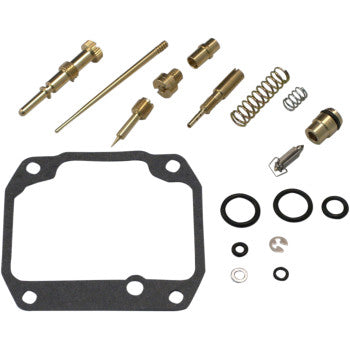 The Suzuki Carburetor Repair Kit by Shindy features float valves, jet needle sets, springs, O-rings, gaskets, and small hardware parts all neatly arranged on a white background.