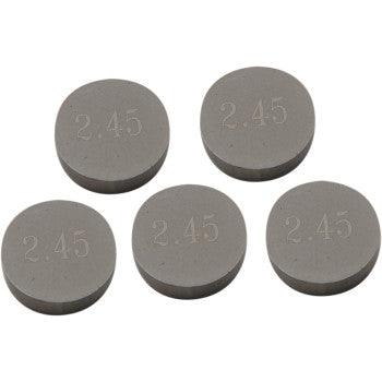 Five Prox Valve Shims (9.48 mm x 2.45 mm), precision machined for durability, are arranged in a loose cluster on a white background. This is a 5 pack with "2.45" engraved on each shim.