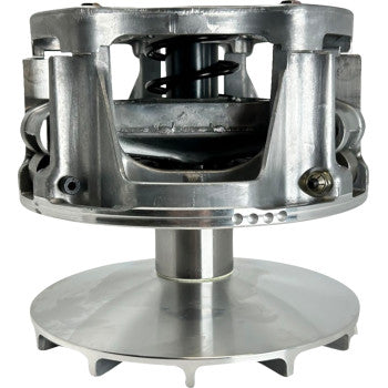 Silver metallic circular primary clutch with visible spring and central shaft for offroad vehicle.