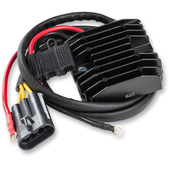 The Polaris Hot Shot Regulator / Rectifier by Rick's Motorsport Electric is a black, heavy-duty unit with cooling fins, attached to red, yellow, and black wires ending in a plastic connector and ring terminal.