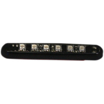 A close-up of the Magic Spot Amber Black by Custom Dynamics, a compact black LED light strip featuring six high-power LEDs in a row, perfect for producing a bright spotlight.