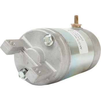 The Starter Motor by Parts Unlimited features a cylindrical metallic housing, protruding mounting brackets, and electrical terminals on one end, engineered to OEM specifications and shown against a plain white background.