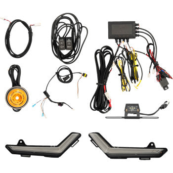 The Can Am Defender Turn Signal Kit Gen 2 by Ravek includes LED daytime running lights, wiring harnesses, connectors, a control module, amber light, and switches—perfect for a plug-and-play UTV turn signal or street legal upgrade. Shown on a white background.
