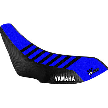 The Yamaha YFZ Seat Cover Blue Black by D'Cor Visuals features a textured blue and black design with black top stripes, white YAMAHA logo on the side, UV-coated Toughtek and dura strength nylon, plus a DCOR logo at the rear for motocross durability.