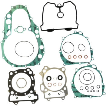 The Suzuki Complete Gasket Kit by Athena, shown on a white background, features green, black, and beige gaskets—including head gaskets—in various shapes and sizes with circular and irregular openings for high-temperature sealing.