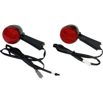 The Turn Signal - Red - Rear by Custom Dynamics features ProBEAM Red Ring LEDs. Two black tail lights with red lenses are attached to black wire harnesses with connectors, each light positioned with the lens facing upward.