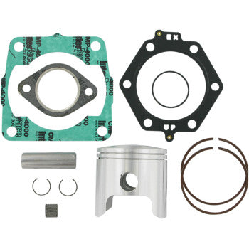 Silver metal piston with two copper-colored piston rings, black and green gaskets, small metal pin, and two circular clips.