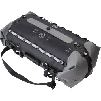 The Tillamook Dry Bag™ 48 Liter Black Gray by Giant Loop is a durable, waterproof duffel with a shoulder strap, multiple buckles, top attachment loops, and an integrated anchor strap system—ideal for outdoor or adventure use.