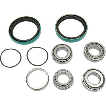 The Polaris Wheel Bearing Kit Front by Pivot Works, featuring double-sealed ball bearings, green and black seals, O-rings, metal bearings, and a metal ring, is shown on a white background for restoring steering control.