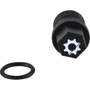 The Engine Drain Plug by Quad Logic, featuring a black steel build and a gear-shaped logo on the head, is shown with a separate black rubber O-ring on a white background to highlight its corrosion protection.