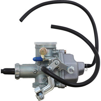 Silver metal Polaris replacement carburetor with black fuel hoses and mounting brackets.
