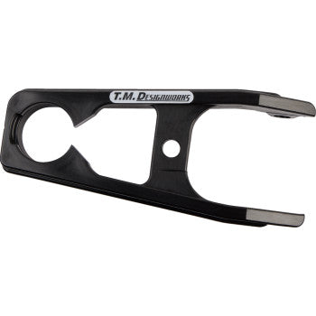 The Kawasaki KFX Front Chain Slider Black by T.M. Designworks is a composite slider with a round opening on one side and pronged ends, built for durability and designed specifically for use on Kawasaki KFX motorcycles.