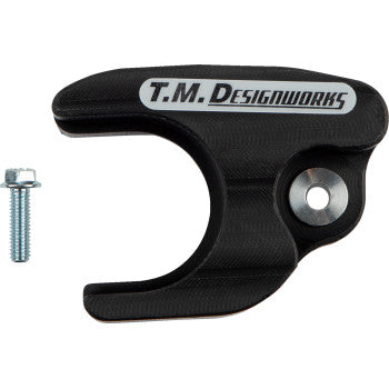 The Yamaha YFZ Front Chain Slider Black by T.M. Designworks is made from advanced composites, with a silver mounting hole and screw for durability, displayed on a white background.