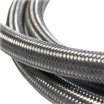 Close-up of the Fiber Braided Hose - Stainless Steel - 10 by Jagg Oil Coolers, showcasing its tightly woven stainless strands, ideal for plumbing or industrial use.