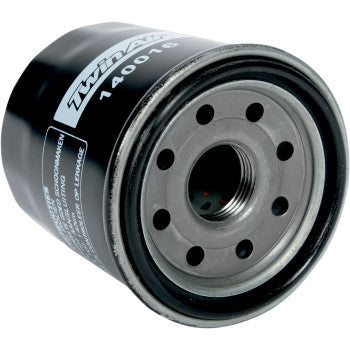 A close-up of the Polaris-Yamaha-Kawasaki Oil Filter by Twin Air shows its black cylindrical design with a metal top, circular holes, threaded center, and quality paper filter inside. The label features Twin Air branding and part number 140016.
