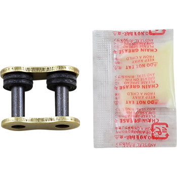 The 520 EXW Rivet Connecting Link Gold by RK is a replacement master link for motorcycle chains, featuring two pins and O-rings, shown beside a small sealed packet of chain grease.
