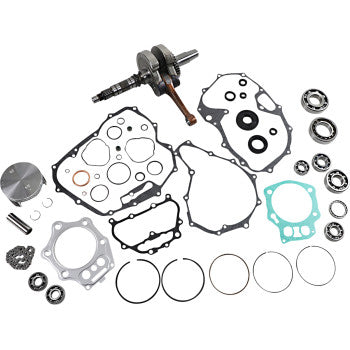 Honda engine rebuild kit with gaskets, piston, crankshaft, rings, and bearings laid out on white background.