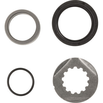 Four components from the Yamaha Output Countershaft Seal by Hot Rods on a white background: a metal ring (top left), black rubber seal (top right), O-ring (bottom left), and silver gear-like washer (bottom right).