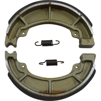 Two semi-circular metallic brake shoes and two small coiled springs are arranged on a white background, showcasing the quality of Polaris - Honda Brake Shoes by DP Brakes, with the springs set between the curved shoes.