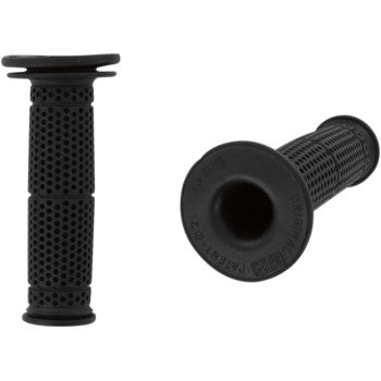 The Dual Sport 714 Rally Grips Black by Pro Grip are shown: two rubber handlebar grips with a dimpled texture, one upright and one flat for viewing the open end. Designed for 7/8 OD handlebars, they offer added vibration dampening.