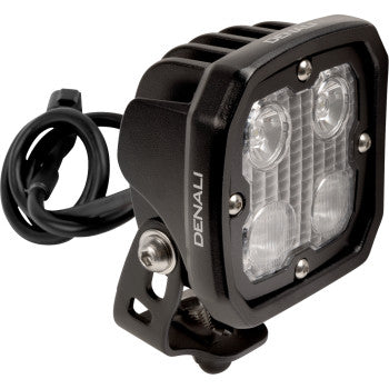 The Denali Light Pod - D4 with DataDim™ is a compact, black square LED light featuring High-Intensity Series Cree LEDs, four clear lenses, a metal mounting bracket, and an attached power cable.