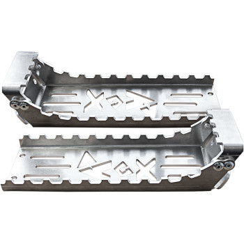 The ATV Footpeg (Traction Pad) by Rox Speed Fx features silver, rectangular metal pegs with jagged edges and cut-out patterns for superior traction, making them perfect heavy-duty pedals for off-road vehicles.