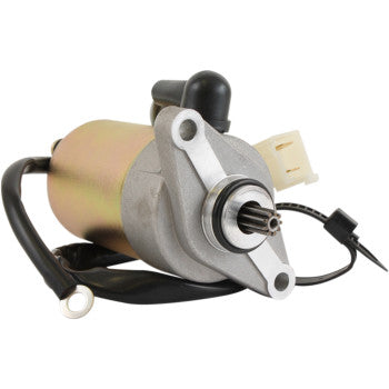 Close-up of the Starter Motor by Parts Unlimited, built to OEM specs with a cylindrical metal body, copper bushings, attached wires, a front gear, and a rear plastic connector, isolated on white.