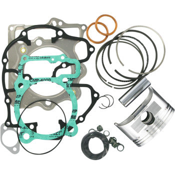 The Honda Piston Kit with Gaskets 85.50 mm by Wiseco includes piston rings, a top-end gasket kit, seals, and small hardware components, all displayed on a white background.
