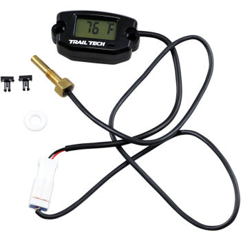 The Universal Temperature Meter Surface Mount Black M6x10 by Trail Tech features an LCD reading 76°F, a black cable, waterproof brass sensor, white connector, and two mounting clips, all displayed on a white background.