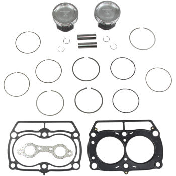 The Polaris Piston Kit with Gaskets 80.00 mm by Wiseco includes two pistons, piston rings, wrist pins, circlips, and two cylinder head gaskets shown neatly arranged on a white background.