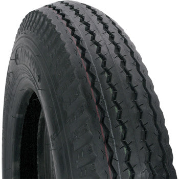 A close-up of the Tire 4.80-12 6 Ply by Kenda, a black rubber trailer tire with a zigzag tread and tubeless nylon construction, photographed at an angle against a plain white background to show the tread and sidewall details.