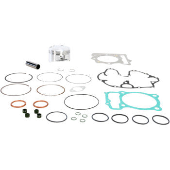 The Honda Piston Kit with Gaskets 85.00 mm by Wiseco includes a piston, gaskets, piston rings, seals, and a wrist pin—all neatly arranged on a white background.