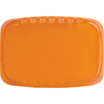 The Light Cover SR-M Series Amber by Rigid Industries is a rectangular, translucent orange cover with rounded edges and grooves on top, resembling a sleek snap-on case for added protection.