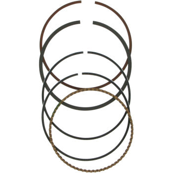 Five piston rings from the Ring Set by Wiseco, including four solid rings and one coil-type oil control ring, are arranged vertically against a white background.