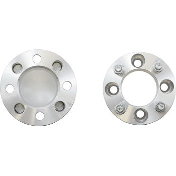 The Spacer Wheel 2 4/110 Pair by High Lifter features two round, silver billet aluminum spacers: the left is solid at the center, while the right has a large central hole and four visible bolts.