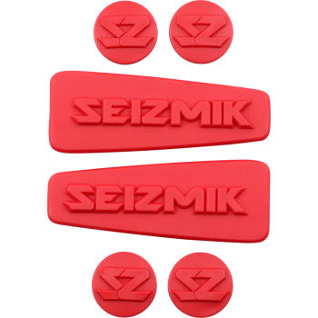 Red rubber Seizmik logo inserts with two rectangular and four circular shapes for custom mirror kit.